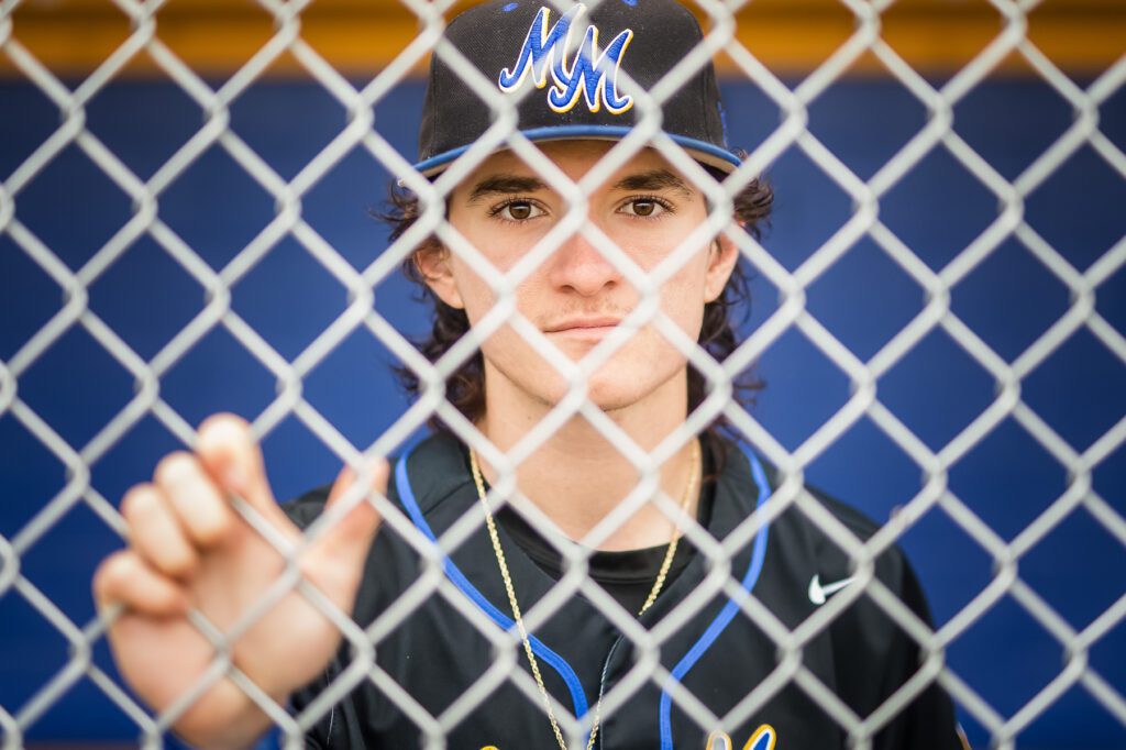 A senior student athlete on his senior photograph