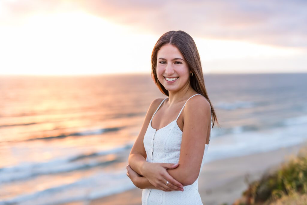 A student pose for her senior photograph