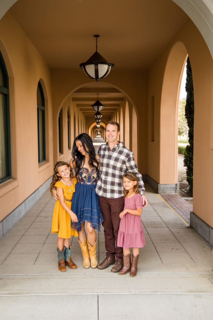 Family of four posing for a family shoot at Liberty Station