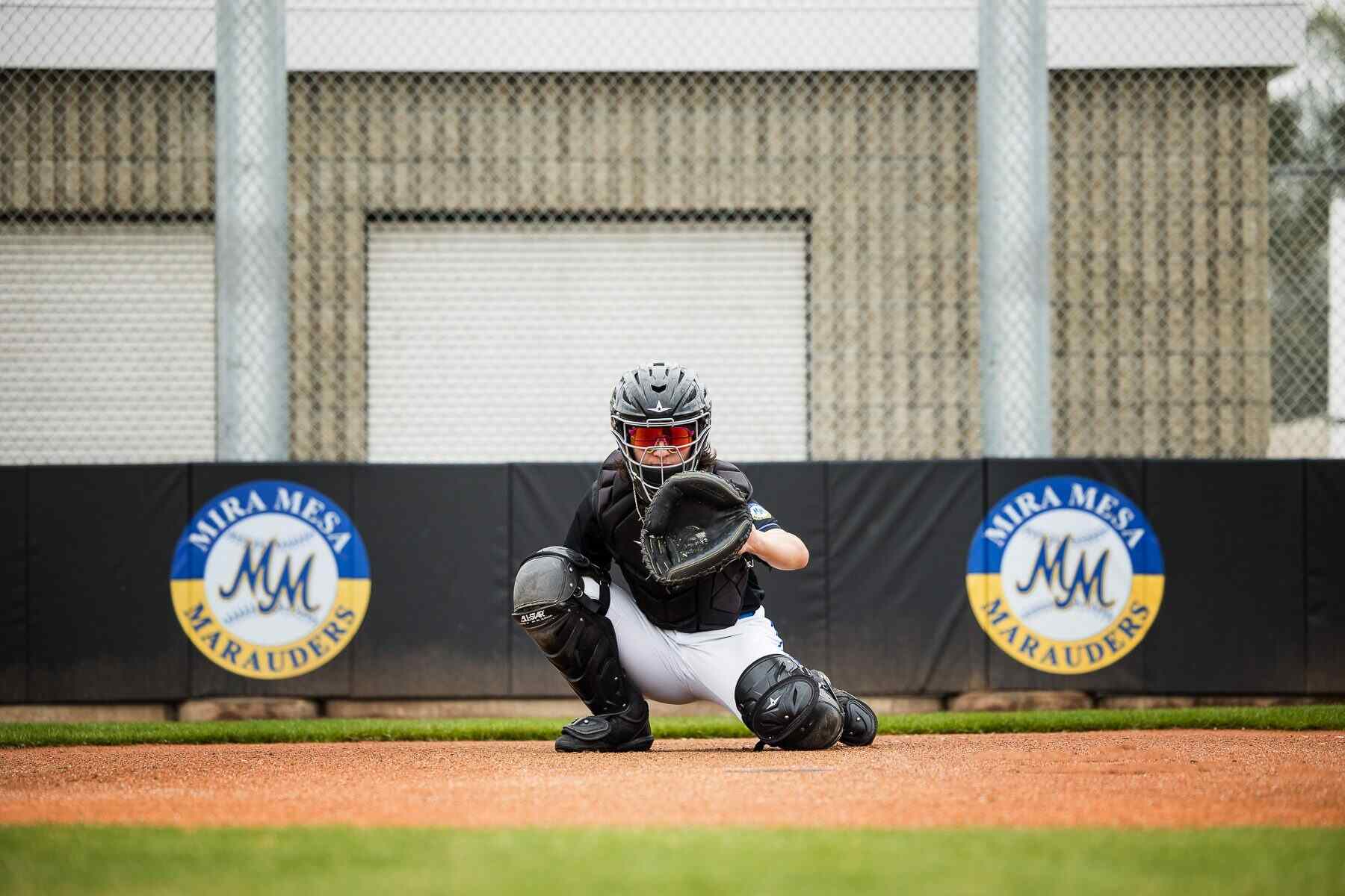 A student while playing his sports posing for his senior portrait