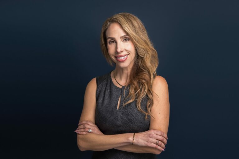 A woman on a studio posing for her branding photo shoot