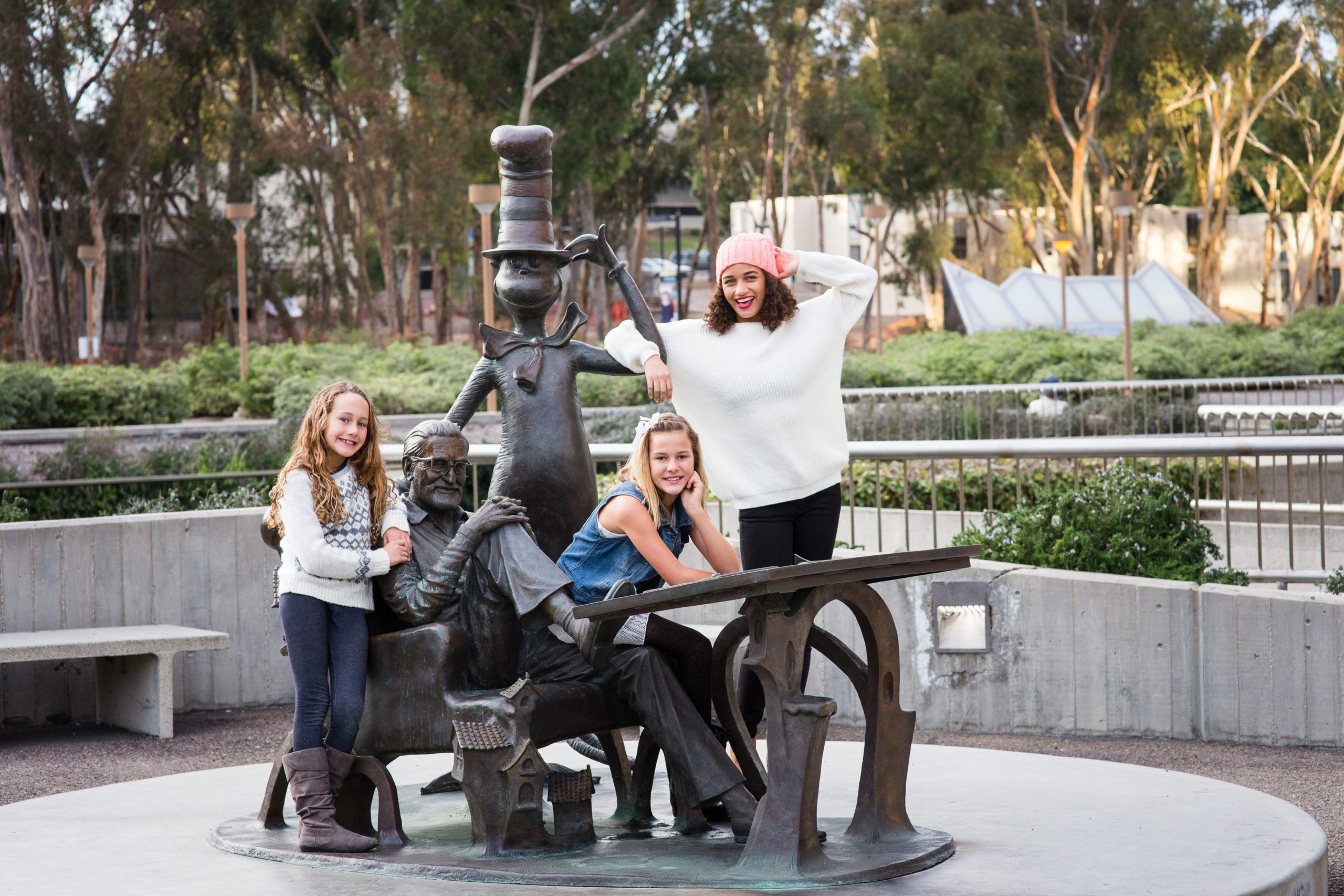 A family posing on a standing figures